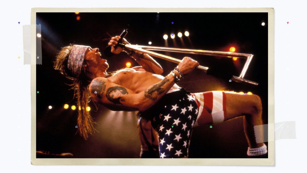 Axl Rose singing on stage during concert in Use Your Illusion Tour